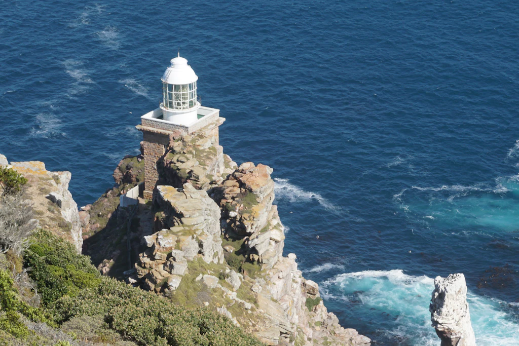 The old Cape Point lighthouse on its rocky peak above the ocean